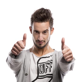 Casual portrait of a young man with thumbs up, over a gray background