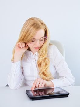 portrait of office girl working with tablet pc