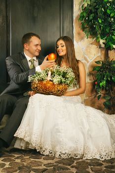 charming bride and groom on porch of house