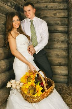 charming bride and groom in hayloft at summer day