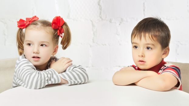 beautiful boy and girl with red bow-knot, portrait
