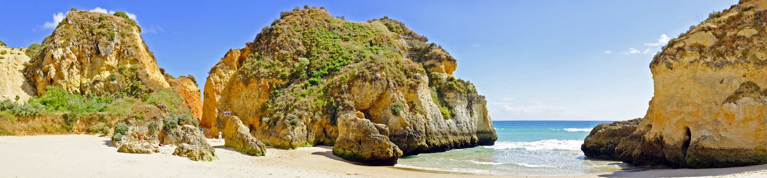 Panorama from rocks and ocean at Praia Tres Irmaos in Alvor Portugal