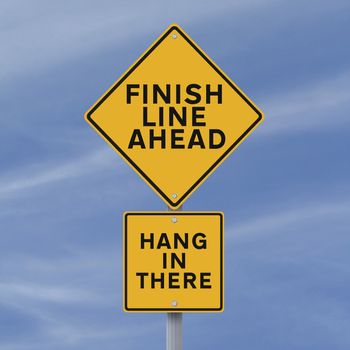 A road sign announcing the finish line coming up