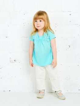 beautiful little girl playing in studio, portrait