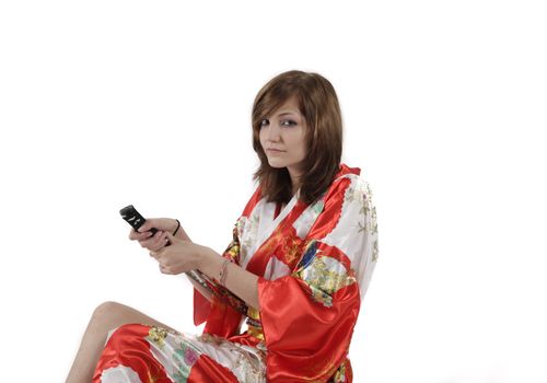 french young girl geisha in red silk kimono with japanese sword