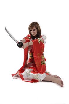 french young girl geisha in red silk kimono with japanese sword