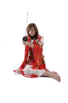 french young girl geisha in red silk kimono with japanese sword