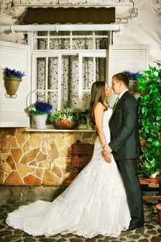 charming bride and groom next house on summer day