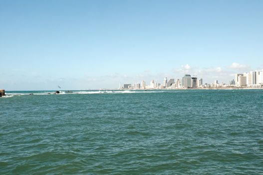 Sea coast and the view of the Tel Aviv from Old Jaffa at the evening .