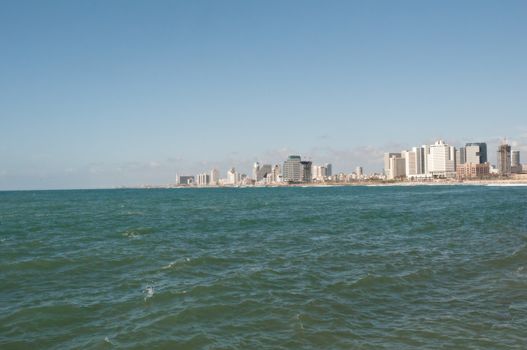 Sea coast and the view of the Tel Aviv from Old Jaffa at the evening .