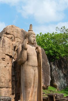 Avukana standing Buddha statue, Sri Lanka. 40 feet (12 m) high, has been carved out of a large granite rock in the 5th century.