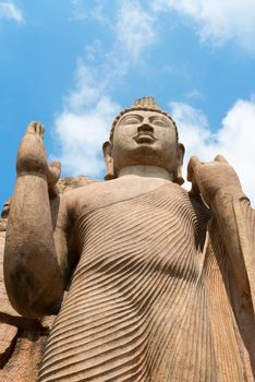Avukana standing Buddha statue, Sri Lanka. 40 feet (12 m) high, has been carved out of a large granite rock in the 5th century.