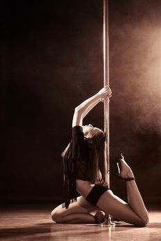 young sexy pole dance woman, dark background