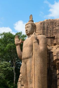 Avukana standing Buddha statue, Sri Lanka. 40 feet (12 m) high, has been carved out of a large granite rock in the 5th century.