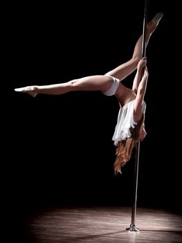 young sexy pole dance woman, dark background