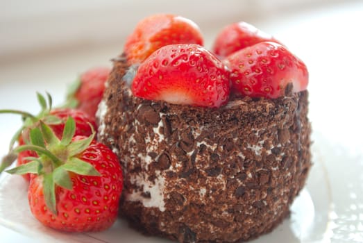 Chocolate cake decorated with strawberries