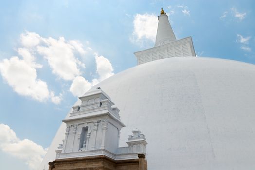 White sacred stupa Ruwanmalisaya under blue sky, Anuradhapura, Sri Lanka