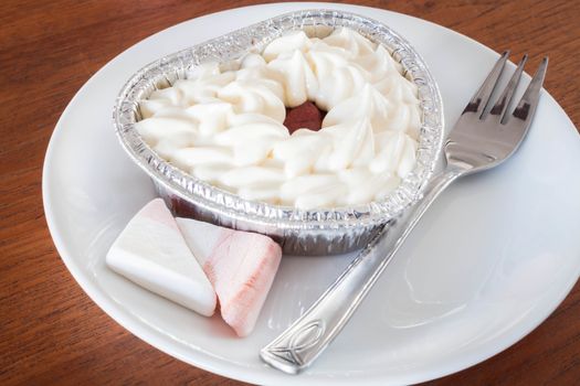 Red velvet cheese cake on wood background