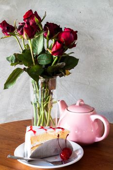 Tea break with vanilla cake on wood table