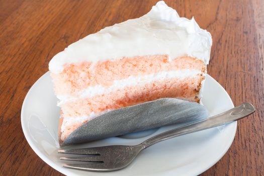 Young coconut cake on wood background