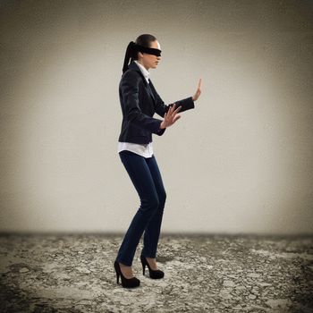 young blindfolded woman. can not find a way out