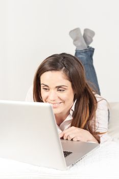 beautiful woman using laptop on sofa