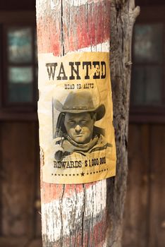 vintage wanted poster in a gost town