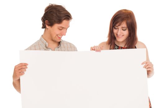 Caucasian couple with blank papers in their hands over white background