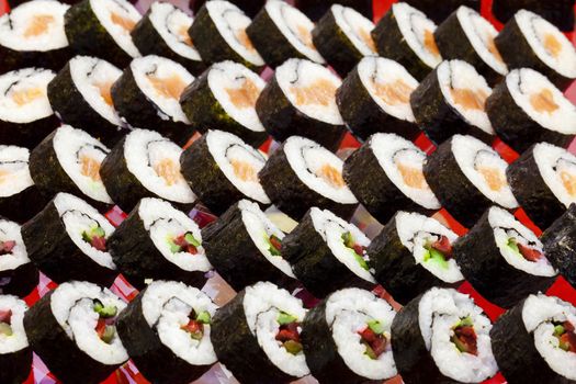 traditional japanese cuisine- sushi rolls served at a party