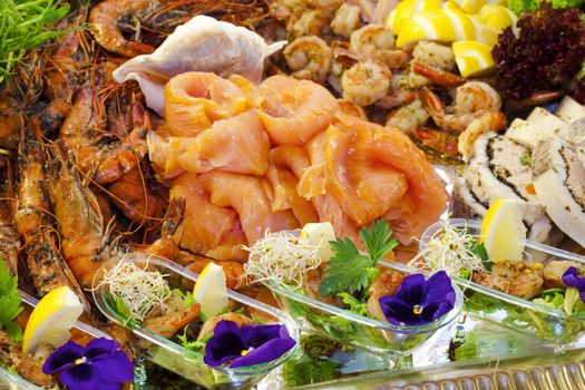 seafood - salmon and shrimps with lemon