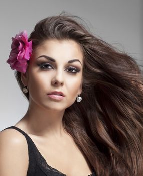 portrait of a young beautiful woman with brown hair looking