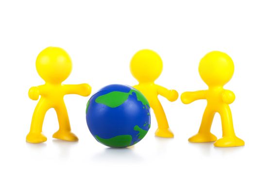  toy little men hold globe. It is isolated, a white background