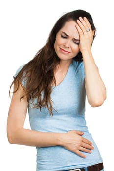 A woman suffering from a headache or migraine. Isolated on white.