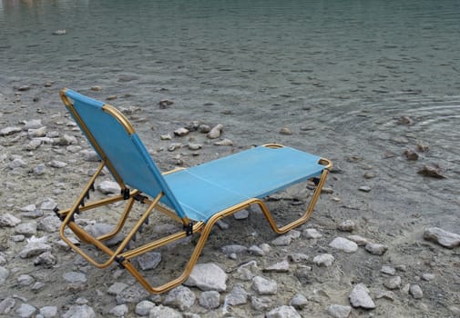 Chair on a shore of  lake .