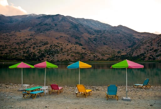 Sunbeds on a shore of Kournas lake. Crete, Greece .