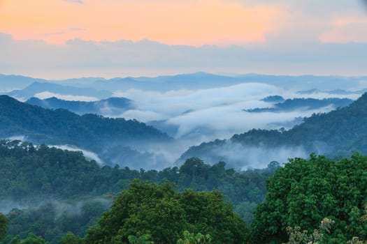 Dramatic clouds with mountain and tree in National Park, Thailand.