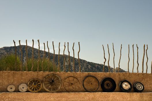 The evolution of the wheel starting from a stone wheel and ending with a steel belted radial tire.