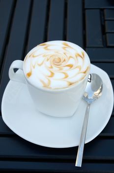 Hot coffee on table in cafe