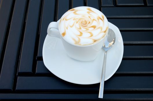Hot coffee on table in cafe