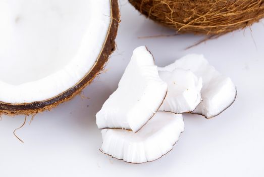 freshly cut coconut and milk isolated on white background