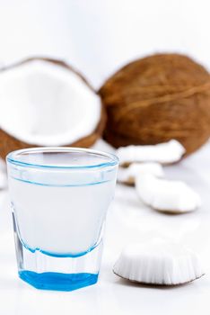 freshly cut coconut and milk isolated on white background