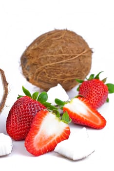 healthy fresh fruits - strawberries and coconut isolated on white background