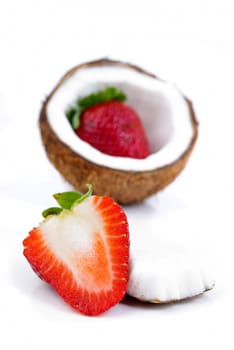 healthy fresh fruits - strawberries and coconut isolated on white background