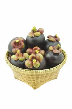 Mangosteen Thai fruit  in wicker basket isolated on white background.