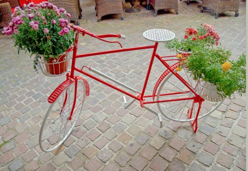 Bicycle like a flower pot .