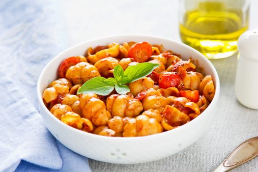 Pasta with tomato sauce and basil