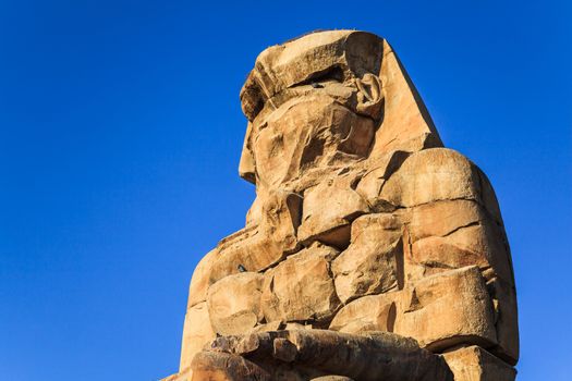 Ancient sculpture of colossus memnon, luxor, egypt