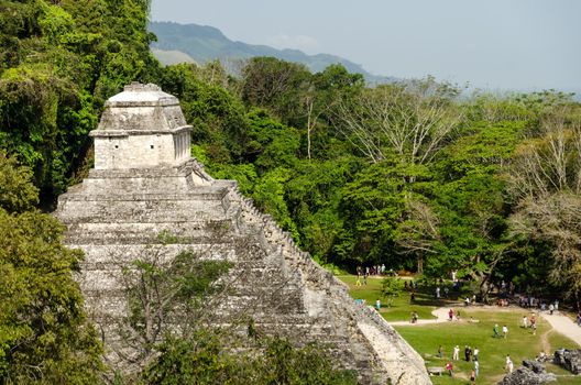 Temple of Inscriptions at Palenque with crowds of tourists down below