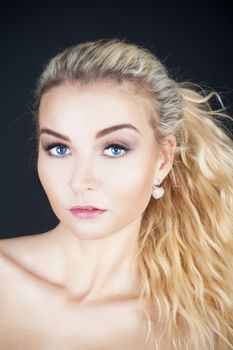 portrait of a young beautiful woman with long blond hair