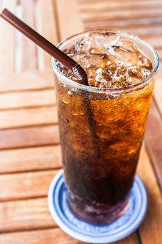 Filled glass with fresh ice cola drink